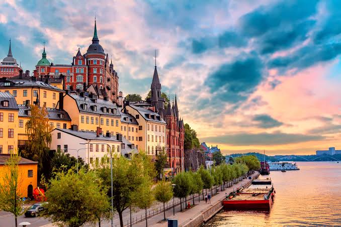 Nordic waterfront city skyline at sunset